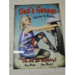 A large painted metal advertising sign 'Dad's Garage'