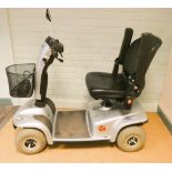 A silver Invacare four wheel pavement mobility scooter in good condition with charger