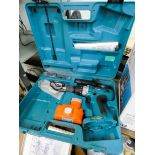 A Makita 18 Volt cordless drill,