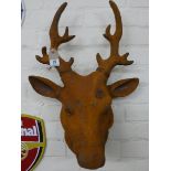 A large life size rusty deer's head
