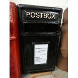 A black reproduction post box