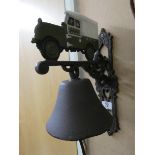 A cast iron wall hanging bell with Land Rover top