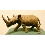A heavy wooden rhinoceros ornament