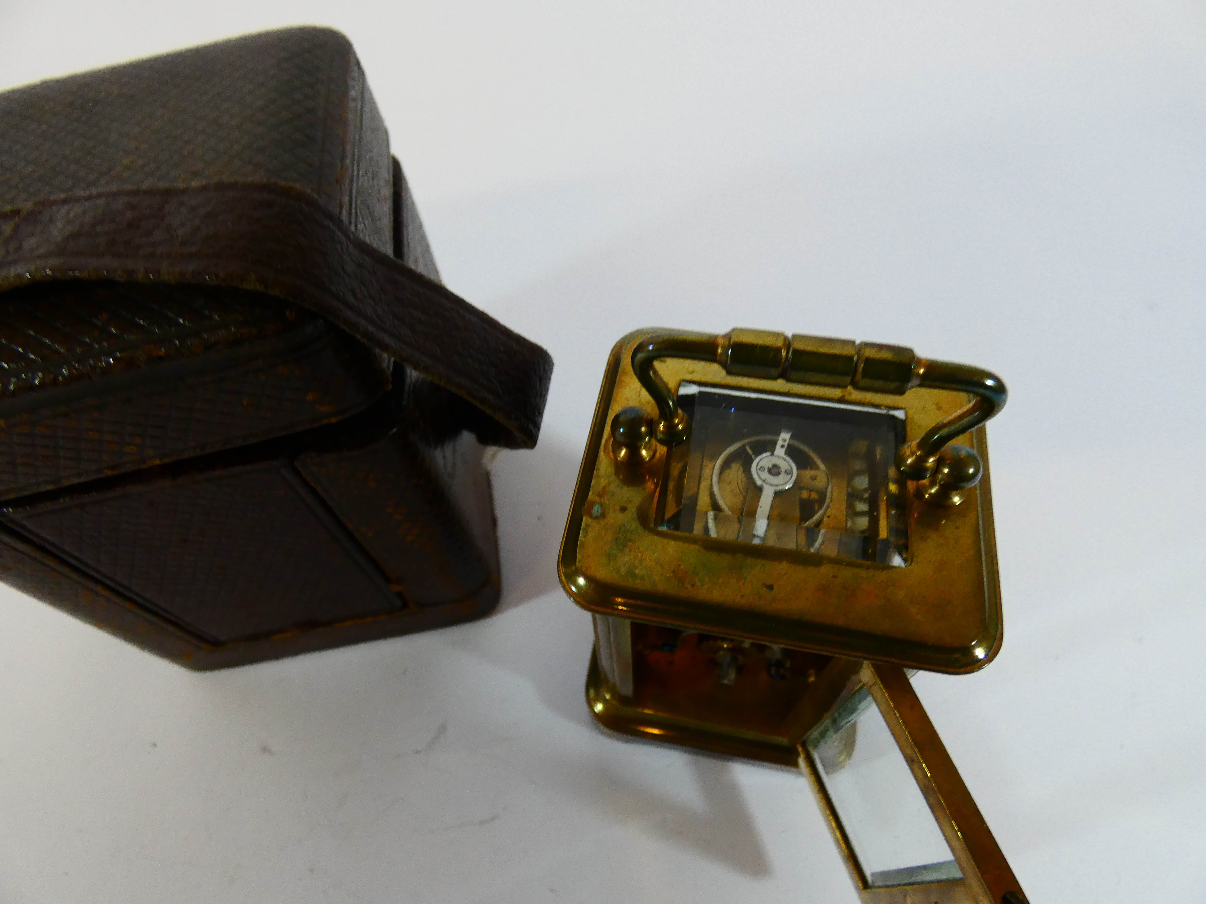 A miniature gilt brass carriage clock with leather travelling case, height with the handle up 9. - Image 3 of 3
