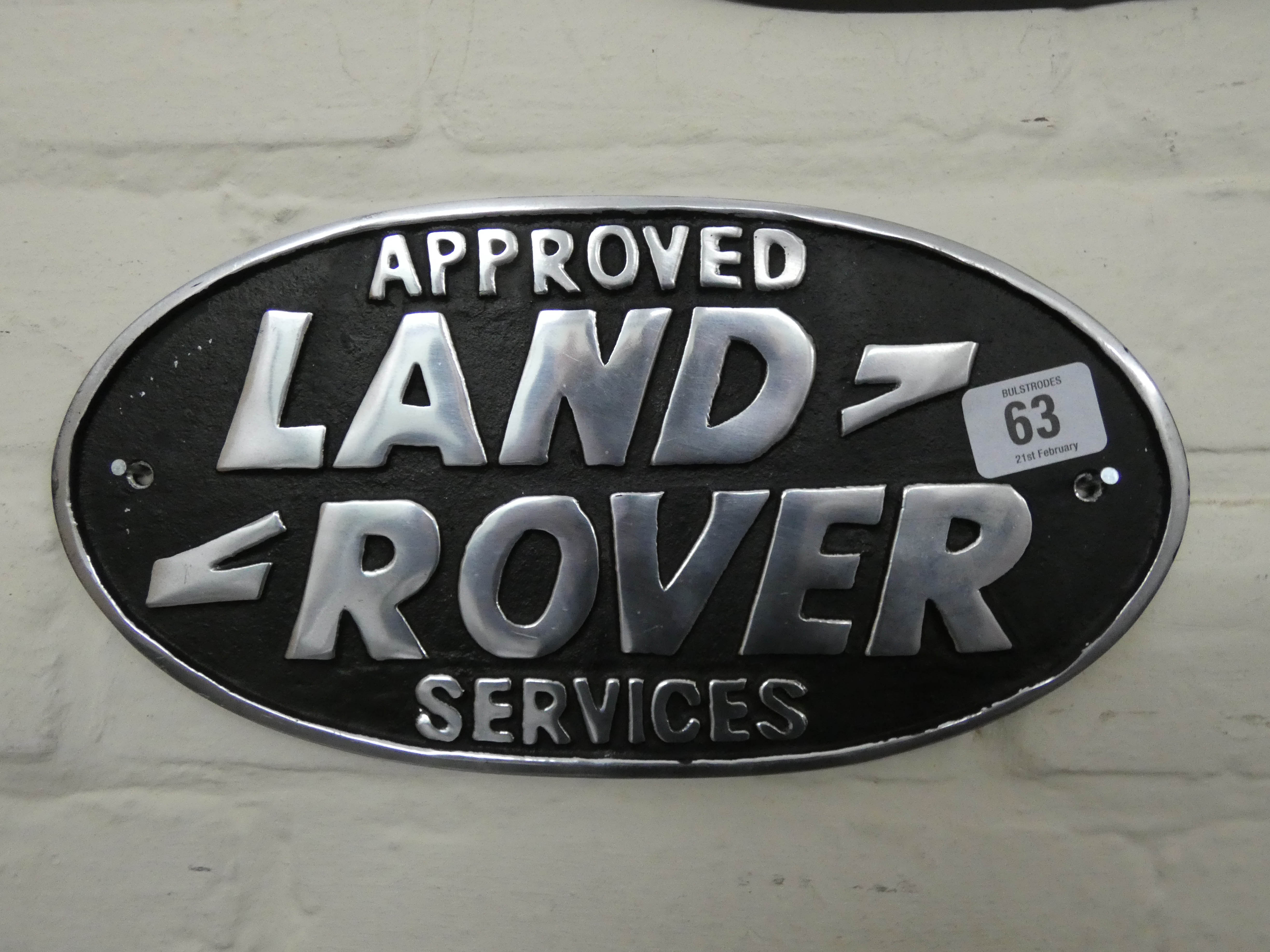 An approved services Land Rover wall hanging cast iron sign