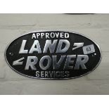 An approved services Land Rover wall hanging cast iron sign
