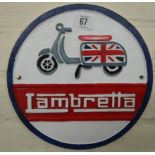 A circular Lambretta cast iron wall hanging sign