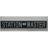 A cast iron station master sign