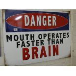 A large painted metal advertising sign 'Danger Mouth Operates Faster Than Brain'