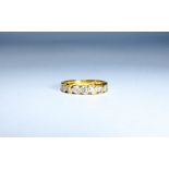 18ct yellow gold seven stone diamond eternity ring, ring size N,