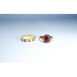 Antique garnet set ring in 9ct rose gold and another antique band set with rubies.