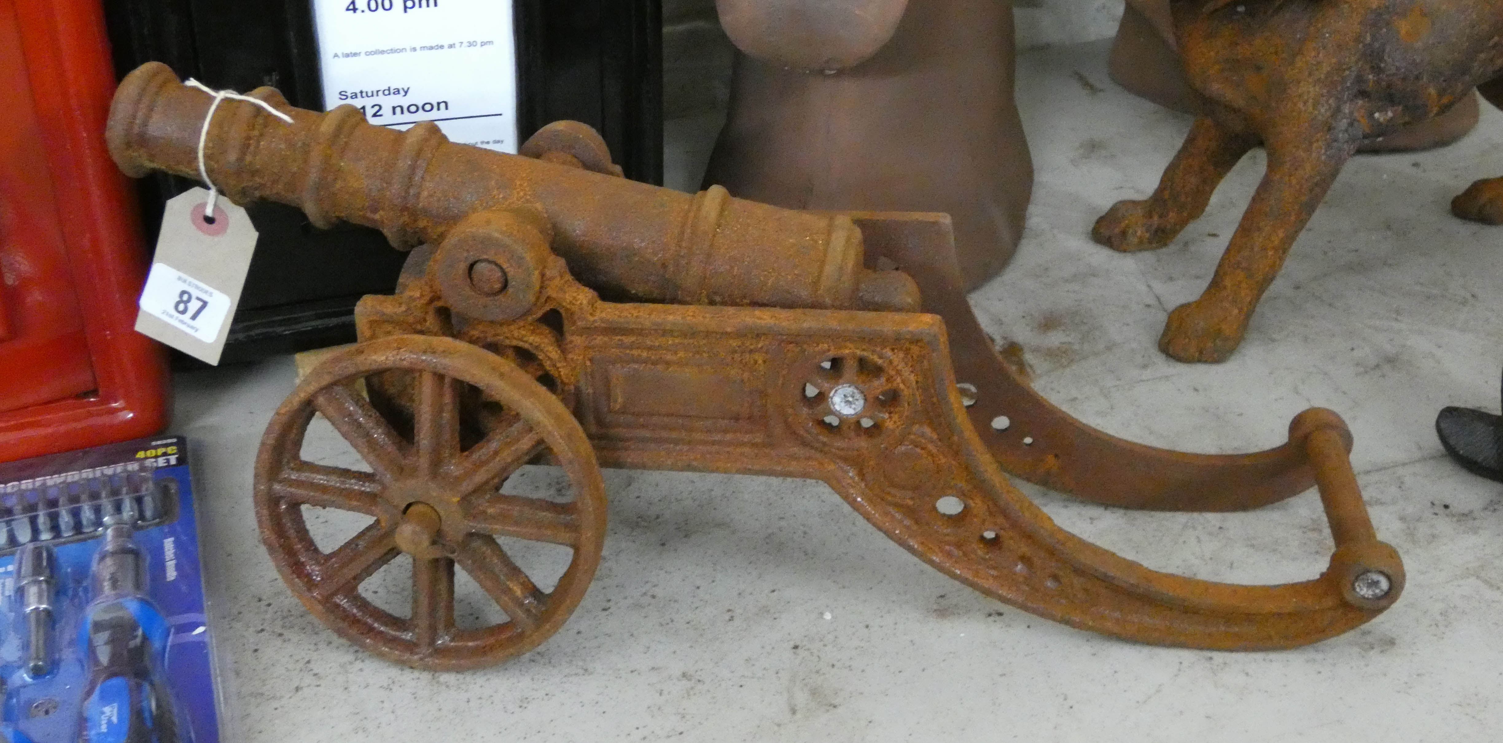 A small rusty cast iron cannon