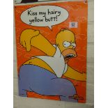 A small painted metal advertising sign 'Simpson's Kiss my Hairy Yellow Butt'