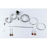 Silver bangles, napkin rings, two pairs of silver and amber earrings,