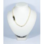 1930's graduated row of cultured pearls with stylish rose cut diamond bow set to the side.
