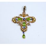 Art Nouveau pendant, set with peridots, seed pearls and sapphires, unmarked yellow metal,