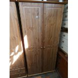 A modern pine two door wardrobe 3' wide