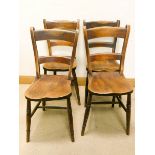 A set of four farmhouse kitchen or dining chairs with panel seats