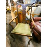 A shied backed elbow chair standing on cabriole legs