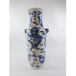 A mid-19th Century blue and white Chinese vase decorated with four claw dragons four character