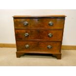 A Victorian mahogany chest of three long drawers standing on bracket feet 3' wide