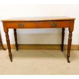 An Edwardian satin walnut writing table fitted two drawers with green inset leather top 3'6 wide