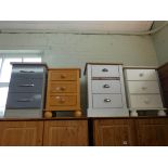 Three various painted three drawer bedside chests and a pine similar one