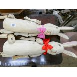 Two large wooden jointed rabbits