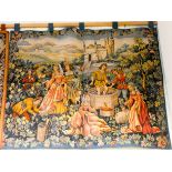 A hanging wall tapestry of grape pickers and wine makers 3' x 3'9