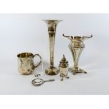 Four pieces of hallmarked silver to include christening mug, posy holder,