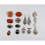 A collection of agate brooches, banded agate locket,