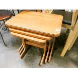 A nest of three modern teak coffee tables