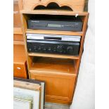 A modern teak HiFi cabinet together with a Sony Tuner,