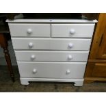A modern white chest of three long and two short drawers,