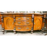 A Victorian mahogany serpentine front sideboard fitted three centre drawers and cupboards,