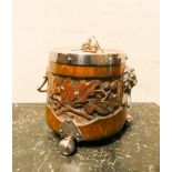 An oak biscuit barrel with carved oak leave panels with plated lid and lion mask handles