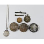 A collection of European and Japanese coins mounted as jewellery