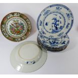 A collection of eight Oriental porcelain plates to include a Famille Rose example and seven blue