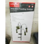A new wild bird feeding station with feeders