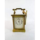 A French gilt brass carriage clock with key,