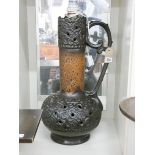 A large brown pottery jug shaped table lamp