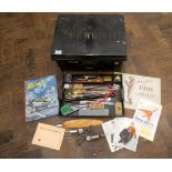 A small tin trunk with inscription Lieutenant Colonel WF Wright with contents to include candle