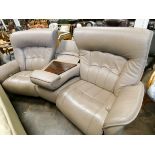 a modern tan leather three seater curved settee reclining either end,