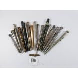 A collection of fountain pens and propelling pencils, many in silver,