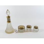 Three small silver topped dressing table jars,