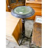 A reproduction mahogany pillar wine table with green leather top on a tripod base