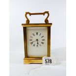 A brass carriage clock,