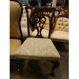 A Chippendale style mahogany elbow chair on cabriole legs with hoof feet and upholstered seat