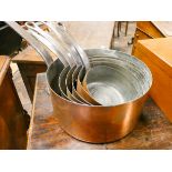 A set of six Victorian copper graduated saucepans