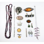 Row of long faceted garnet beads, art nouveau cufflinks, jade pendants, agate brooch,